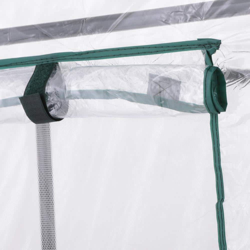 Portable greenhouse featuring roll-up doors