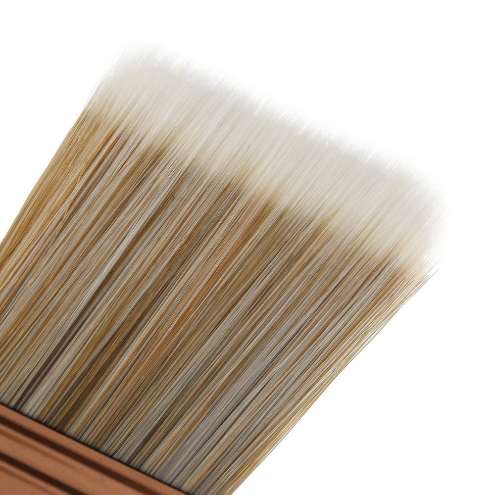 Paint brush with a soft-tip bristle for easy pickup and release of paint