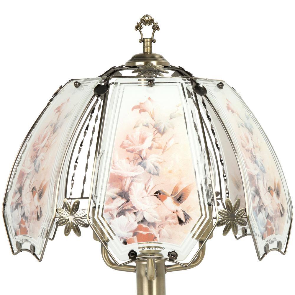 Lamp featuring a hummingbird scene on the shade panels