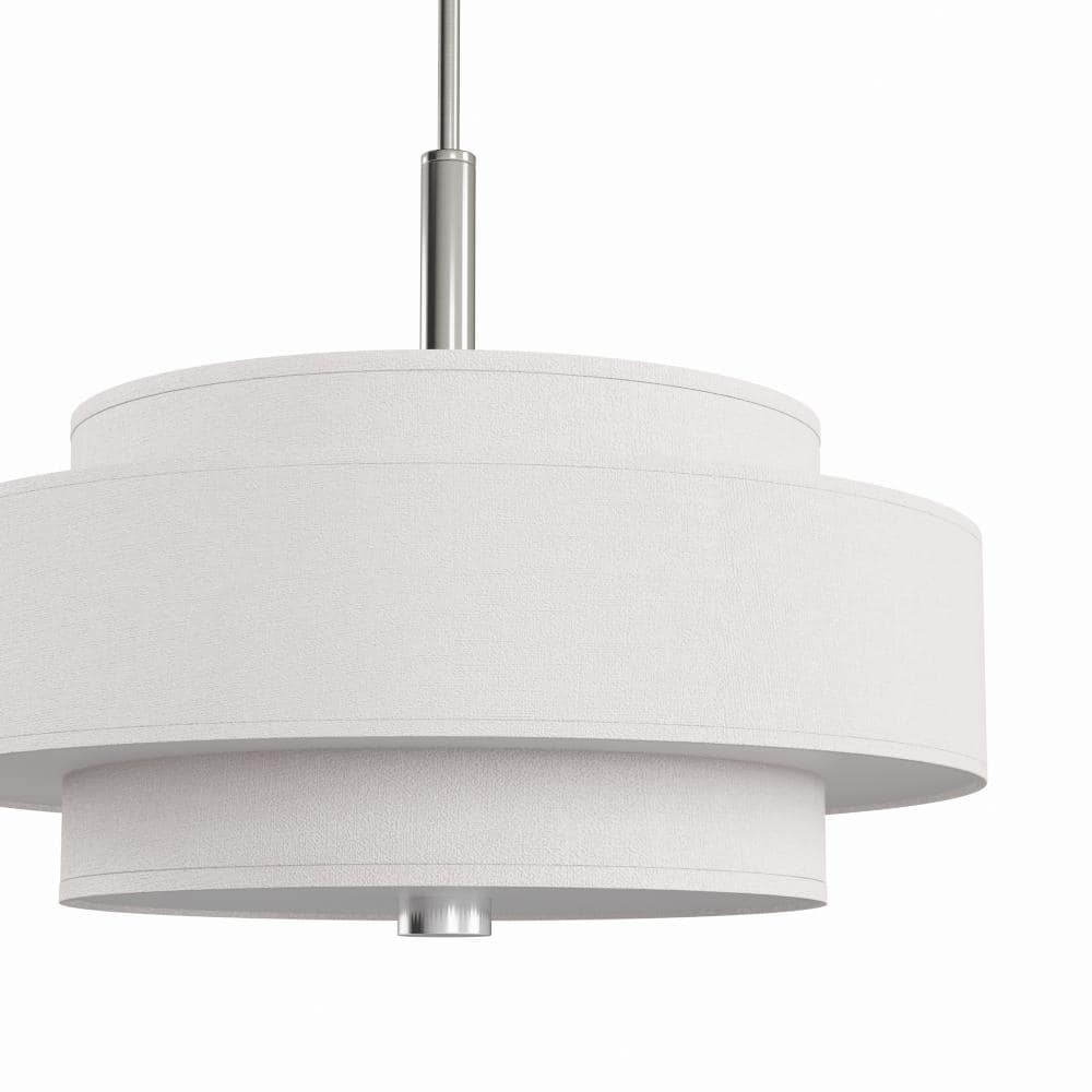 Pendant light featuring a layered drum shade