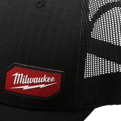 Trucker hat featuring a red brand label on the front