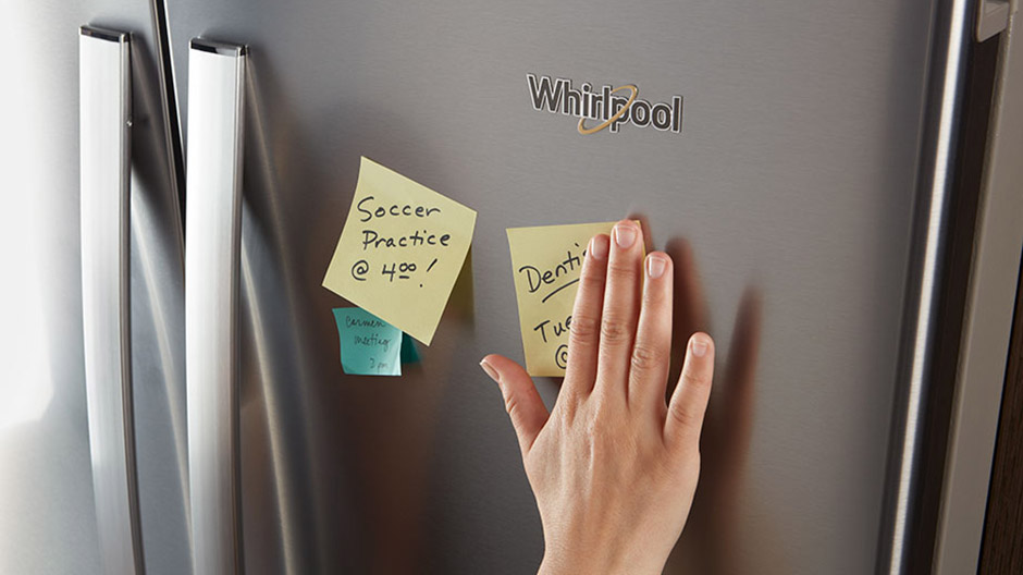 Front of the Fingerprint-Resistant Stainless Steel refrigerator with reminder notes stuck to it.