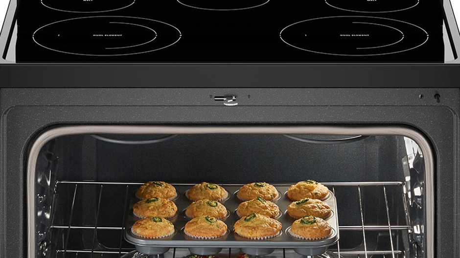 Muffins rising in the oven.
